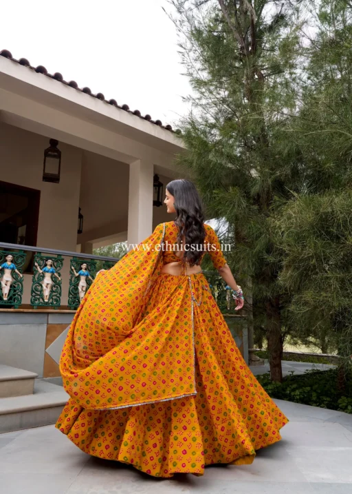 Backless Stitched Blouse Paired with Bandhani Printed 7 Mtr Chaniya Choli For Navratri 2026