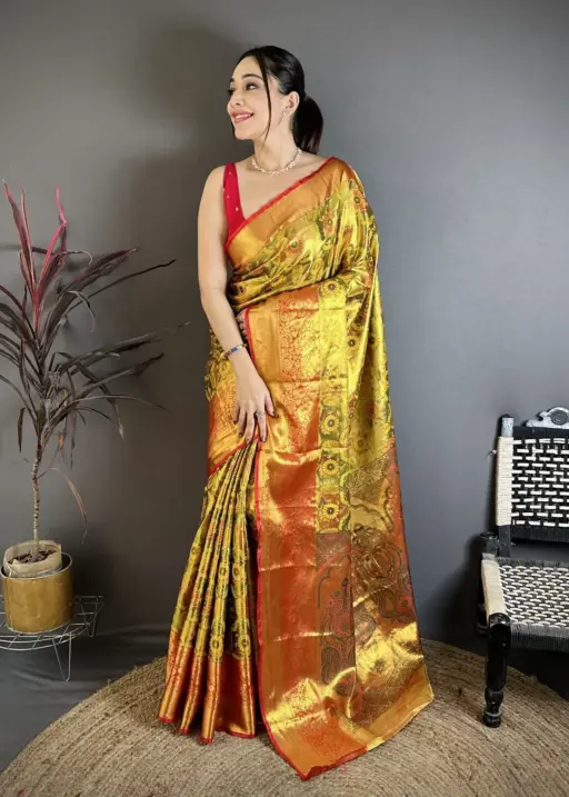 Golden traditional Kanjivaram silk saree for women with zari woven pallu and traditional festive design
