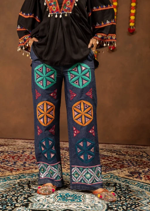 Kutchi Work Denim Jeans for Navratri and Garba Nights, It has Stitched Multi Color Kutchi work Patches which give the best Look and also can be wear in multiple functions Such as Boho Bags that we Carry In Multiple Places this Denim can Be Wear In Collages,