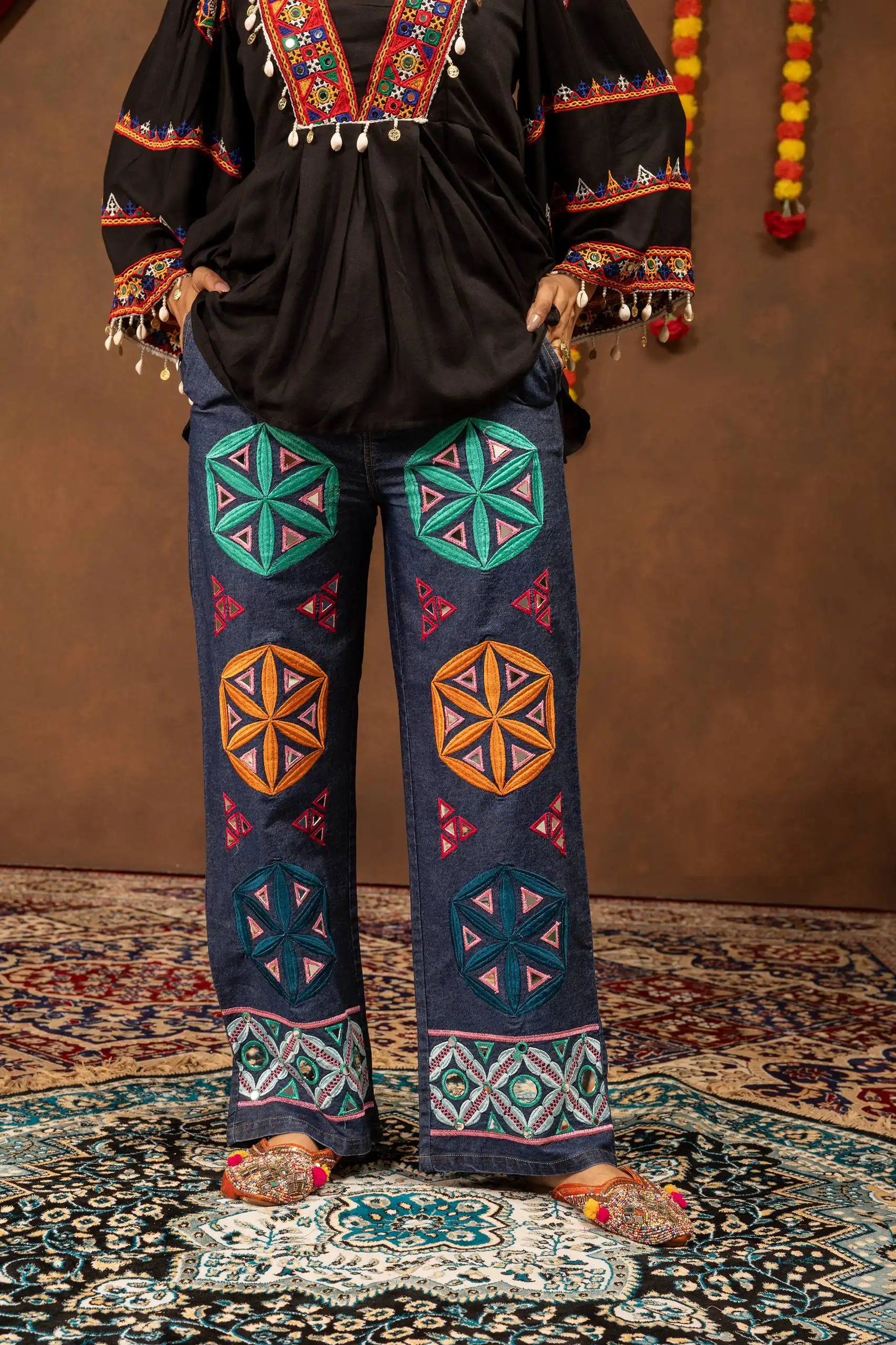 Kutchi Work Denim Jeans for Navratri and Garba Nights, It has Stitched Multi Color Kutchi work Patches which give the best Look and also can be wear in multiple functions Such as Boho Bags that we Carry In Multiple Places this Denim can Be Wear In Collages,